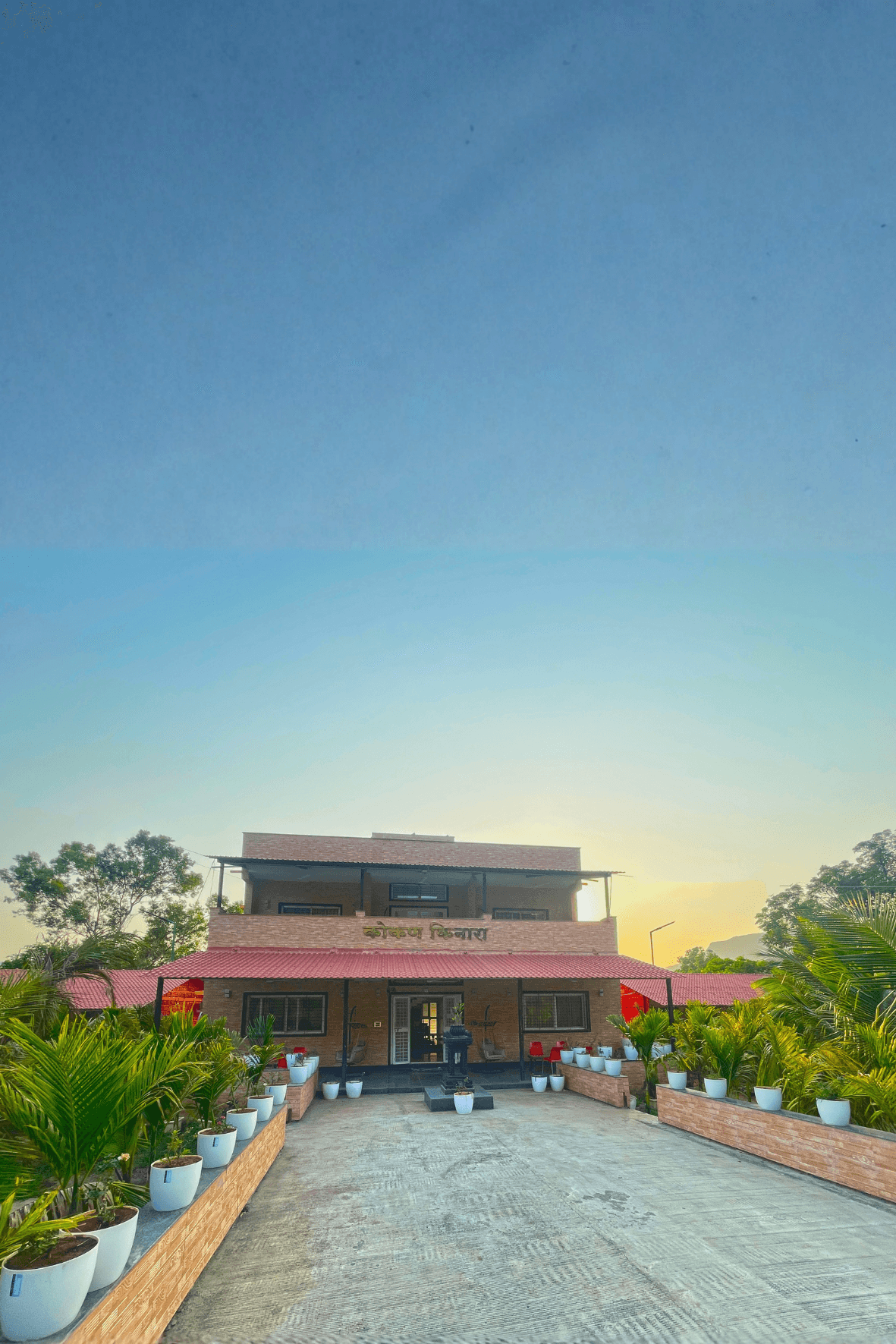 Kokan Kinara villa hero showing the pool and palms