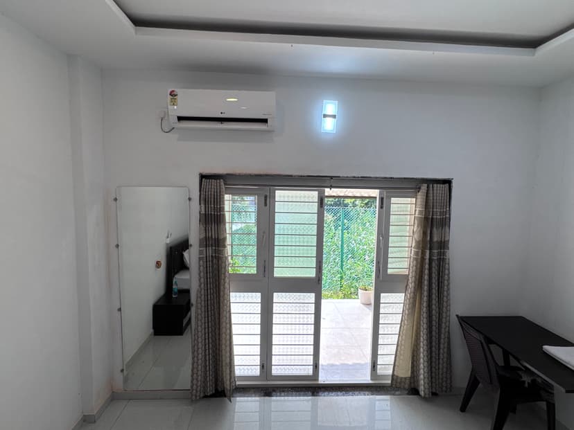 Retreat bedroom view from the back door showing the interior layout and amenities
